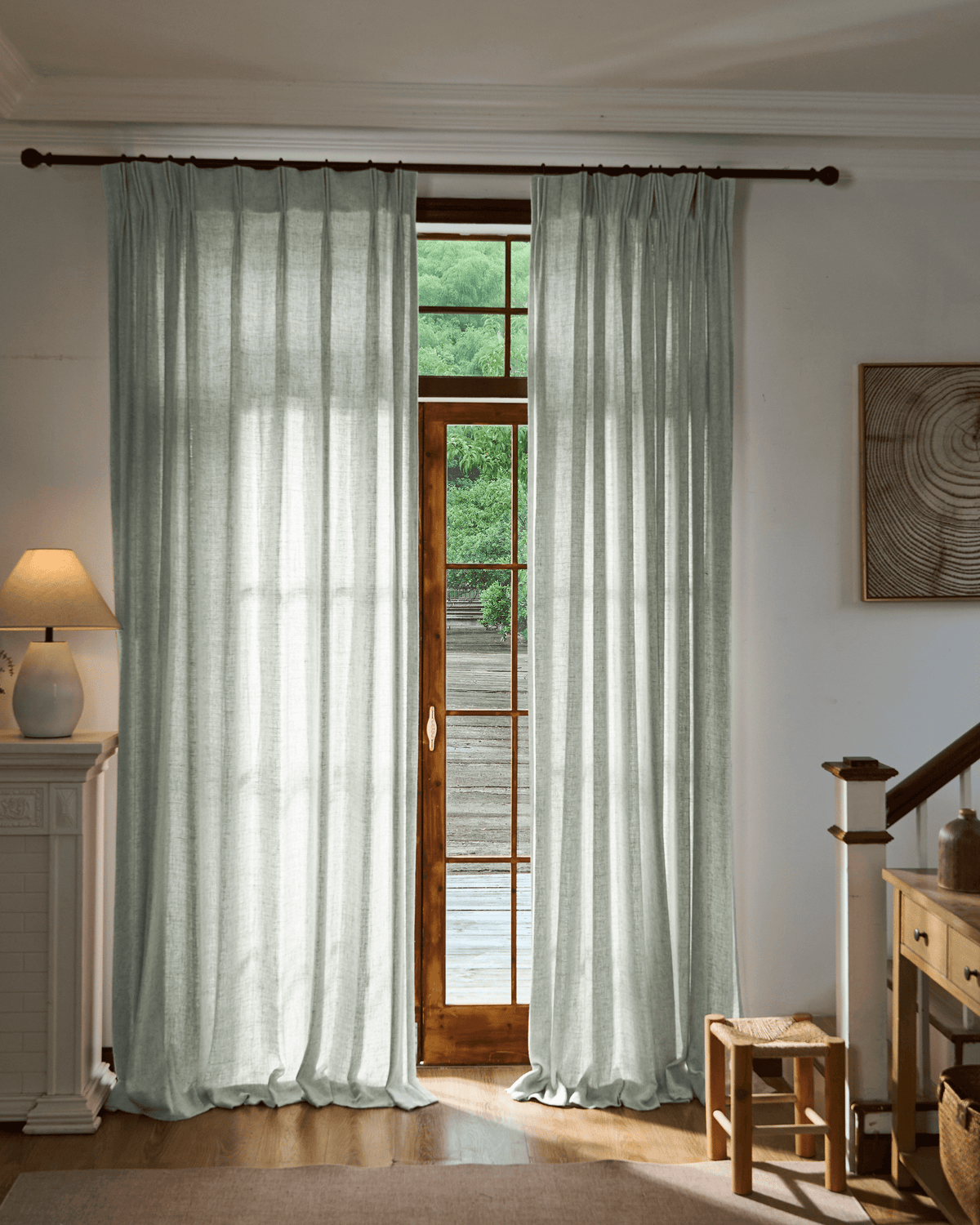 Elegant Fiona Linen Blend custom curtains in a natural sage color, framing a wooden door with outdoor view, offering soft light control.