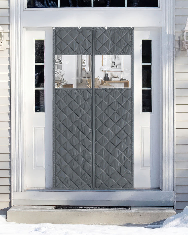 Dark grey Oxford custom magnetic door curtain with clear PVC windows installed on a white front door, offering thermal insulation & soundproofing in winter.