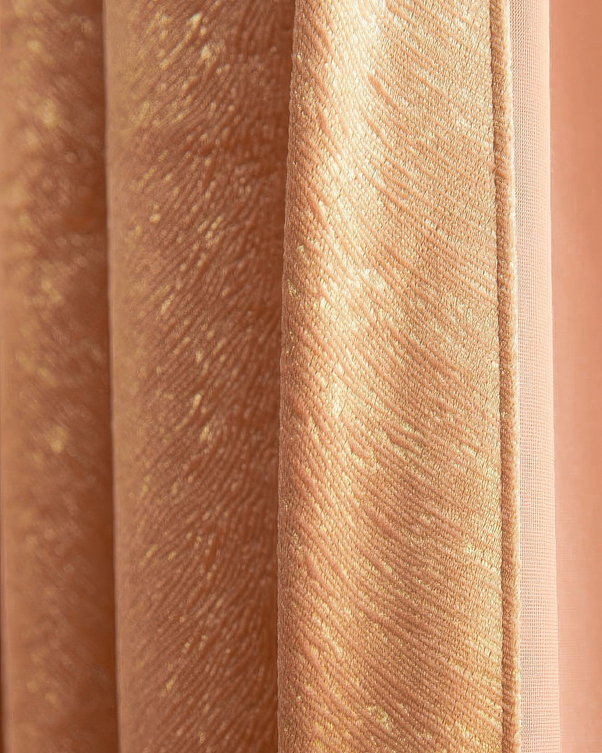 Close-up of Palma custom curtain velvet fabric showcasing the peach-toned, foil printed, textured diagonal pattern details.