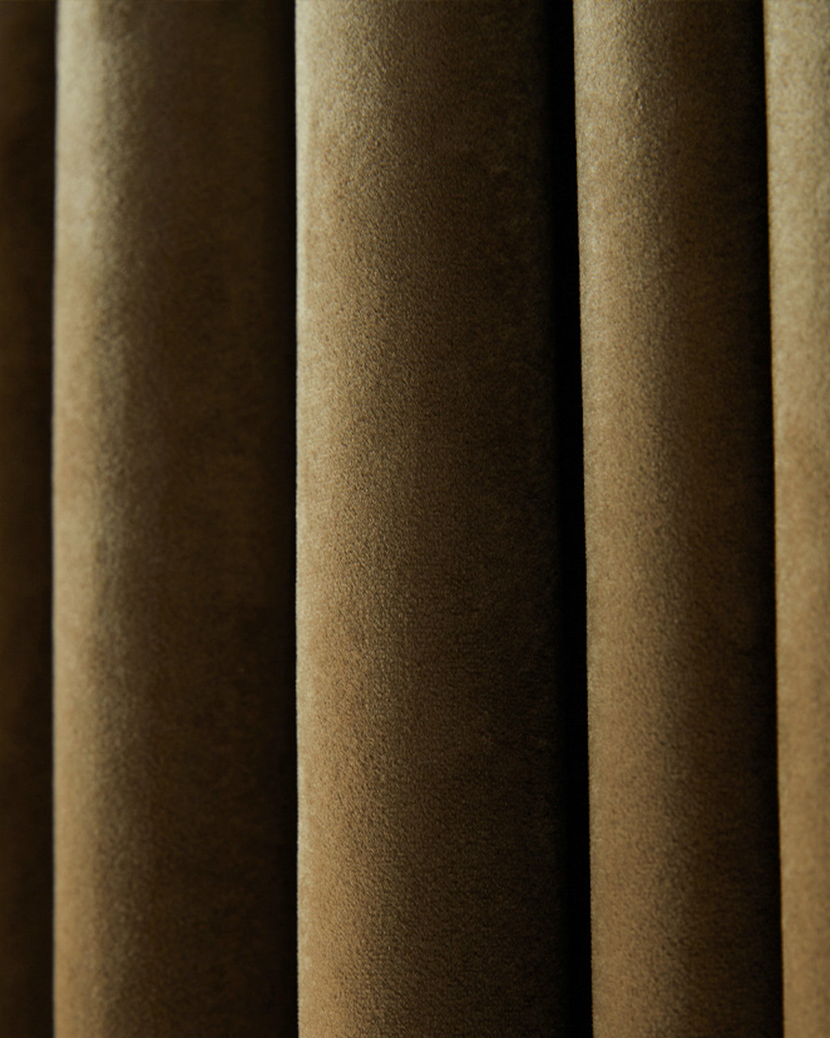 Lush, custom Moonlit Velvet curtain in deep bronze, showcasing its plush texture and sophisticated drapery folds for elegant window treatments.