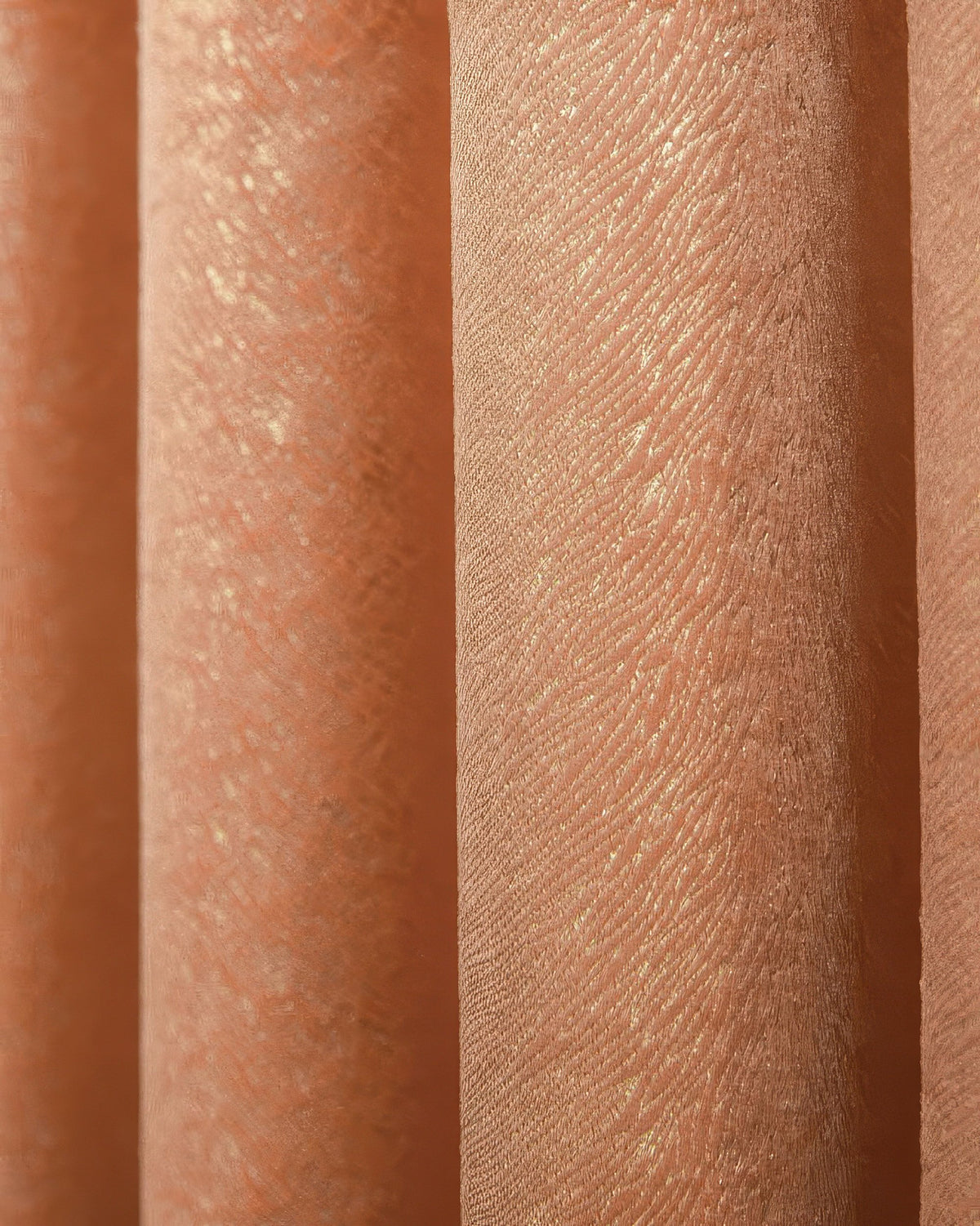 Close-up of Palma foil printed velvet custom curtain, showcasing its shimmering diagonal pattern in elegant rose gold.