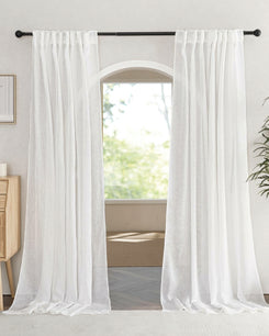 White Wengen Linen & Cotton Blend airy sheer custom curtains with a gathered header, hanging on a black rod, framing a bright arched window.
