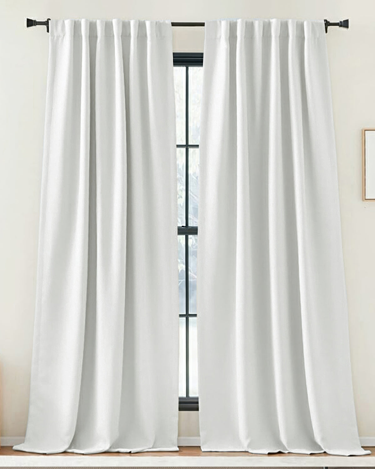 Zoe pure white linen-look custom drapery with tab top header, elegant window treatment on black rod, creating soft ambiance.