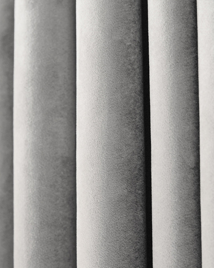 Luxurious Moonlit Velvet custom curtain close-up, highlighting plush silver-grey fabric texture and soft pleats.