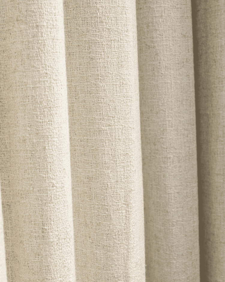 Close-up of the Fiona linen blend custom curtain fabric, showcasing its natural textured weave and elegant, soft drape.