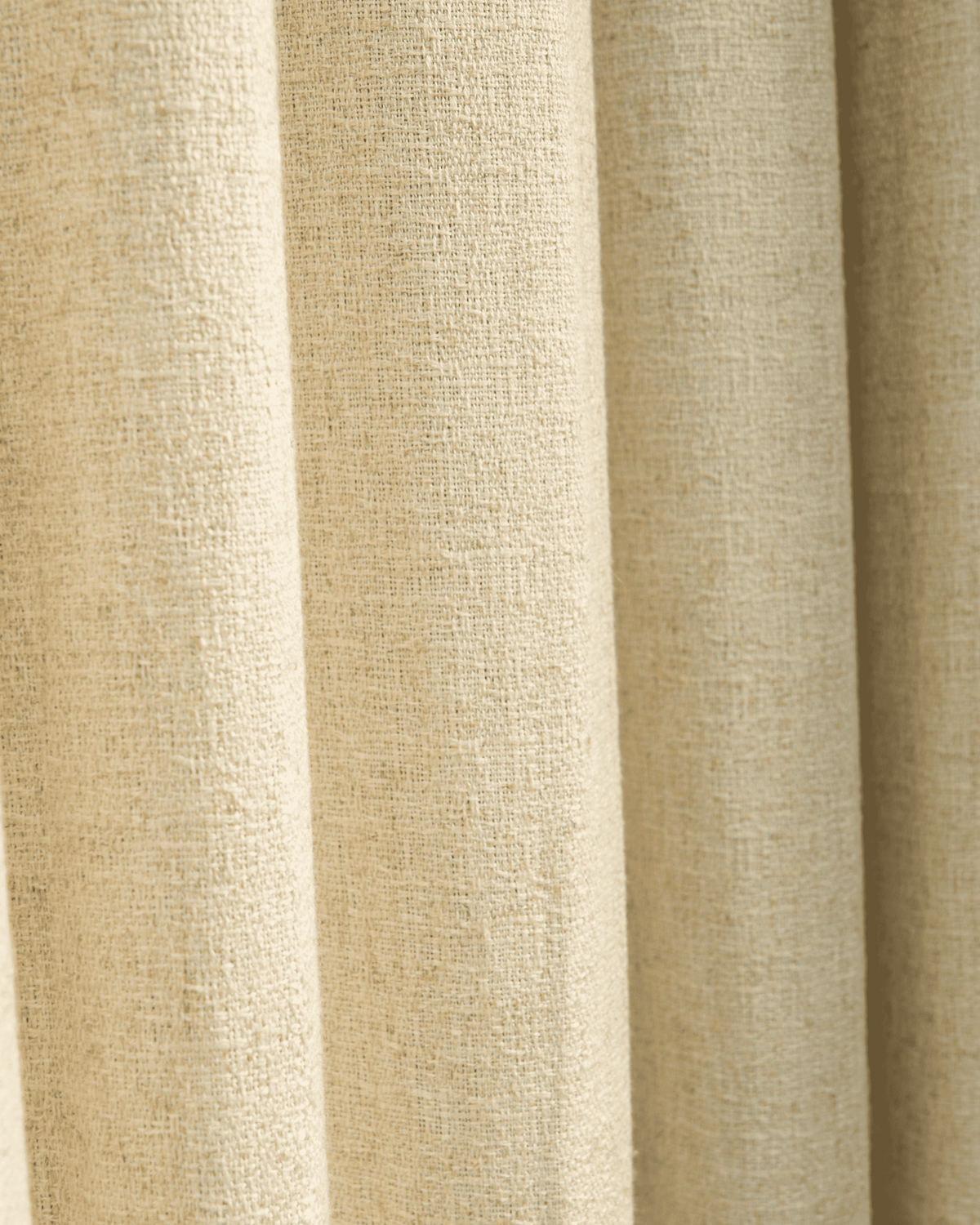 Close-up of Fiona Linen Blend custom curtain fabric, showing its natural woven texture and elegant drape for home decor.