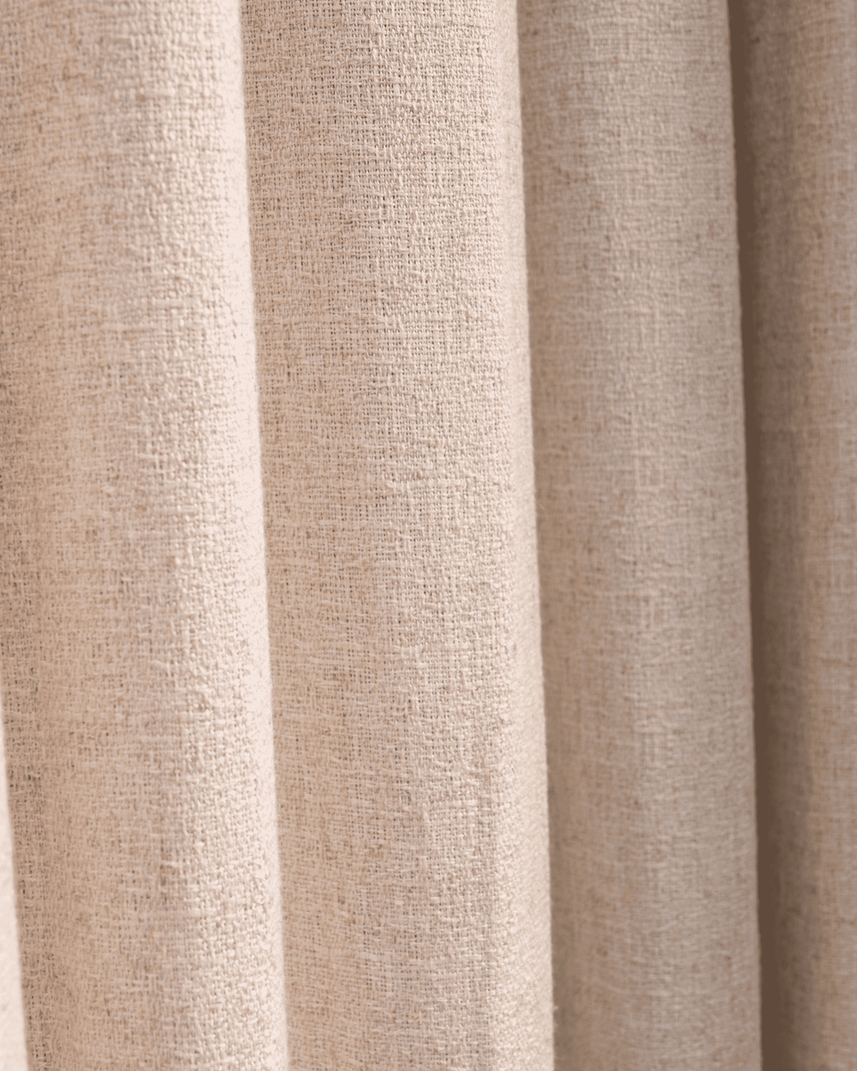 Detailed view of Fiona Linen Blend custom drapery fabric, highlighting its natural, woven texture and light beige color.