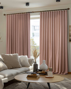 Florence textured rose 100% blackout custom drapery providing thermal & soundproof privacy in a stylish living room.