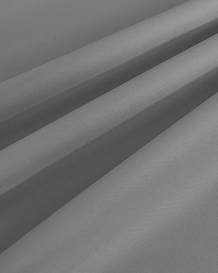 Close-up of grey FadeShield Pro™ fade-resistant & waterproof lightweight fabric swatch with visible fine weave texture.