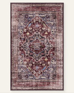 Diana's Garden washable rug: distressed burgundy, blue, gold traditional floral medallion pattern, evoking a fantasy garden.