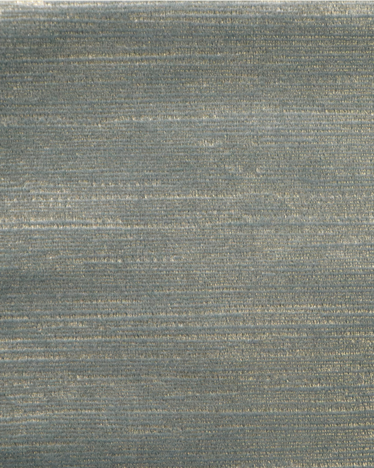 Close-up of luxurious blue-grey foil printed velvet custom curtain fabric with subtle horizontal metallic texture.