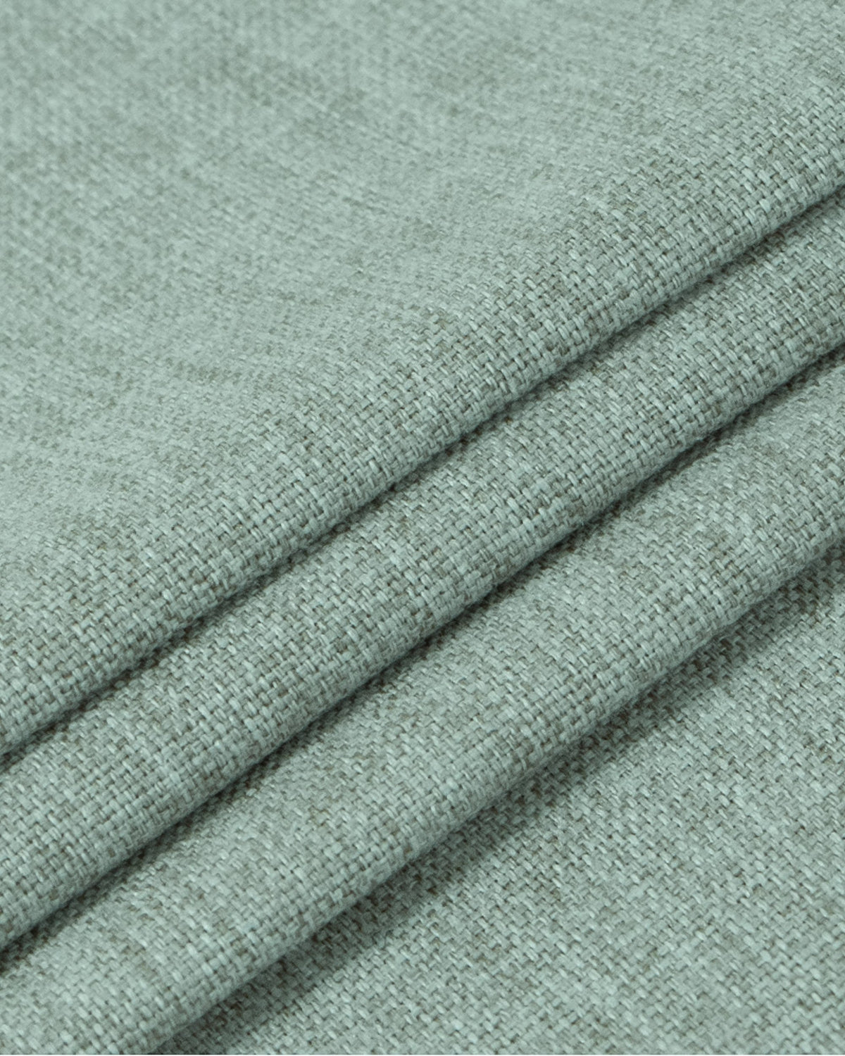 Close-up of Victoria 100% blackout OEKO linen look heavyweight custom curtain fabric in a muted green shade, showing woven texture.