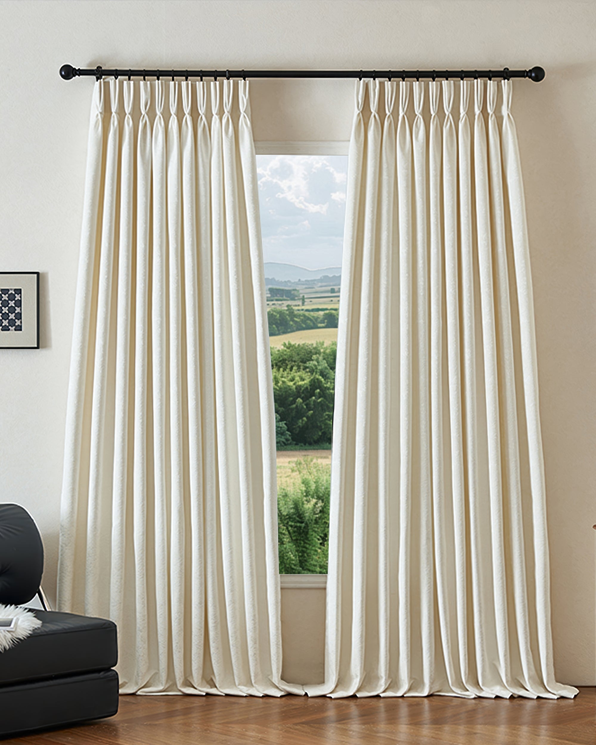 Cream custom blackout curtains with pinch pleat header. Ambient thermal, soundproof jacquard linen blend fabric. Scenic window view.