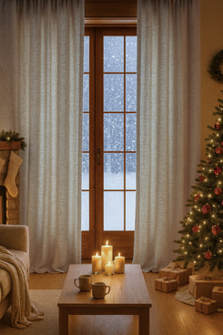 Fiona Linen Blend Custom Curtains in light textured fabric, framing a snowy window, providing warmth & privacy in a sophisticated holiday setting.