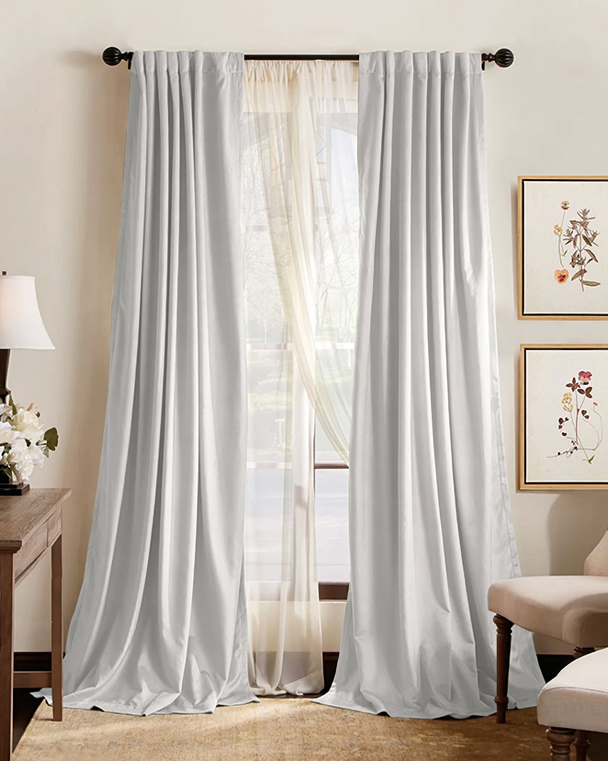 Custom light grey pleated blackout curtains over sheers, offering 100% blackout, soundproof, and thermal insulation for elegant home decor.