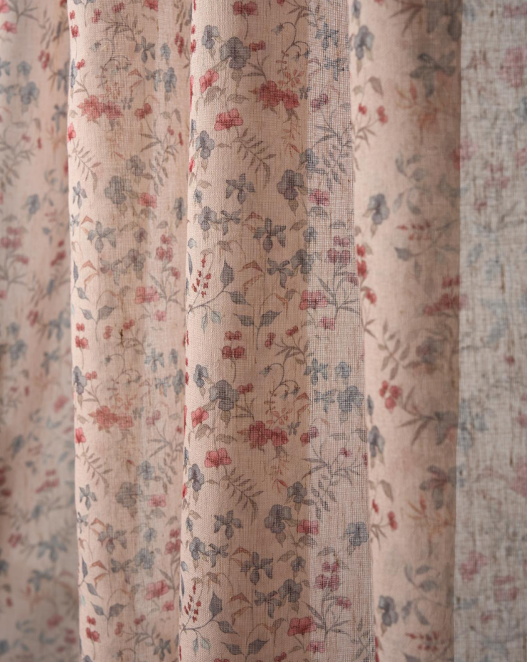 Close-up of Sway Floral Patterned Sheer fabric with delicate red and blue blossoms on a cream linen-textured weave.