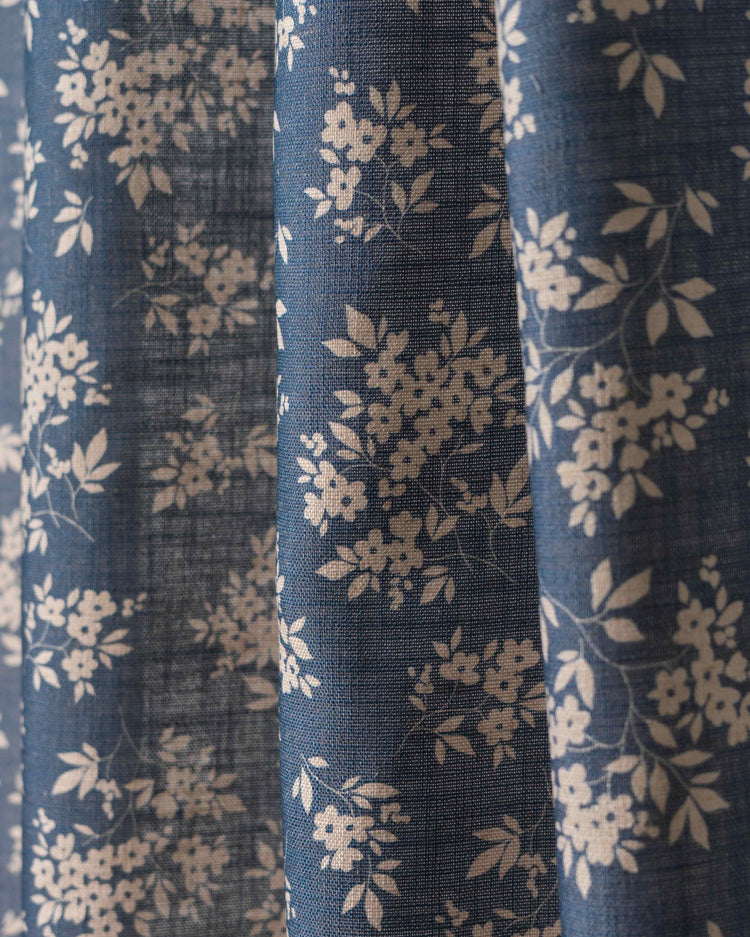 Haven Linen Blend floral patterned fabric swatch in blue with delicate white flowers for custom window treatments.