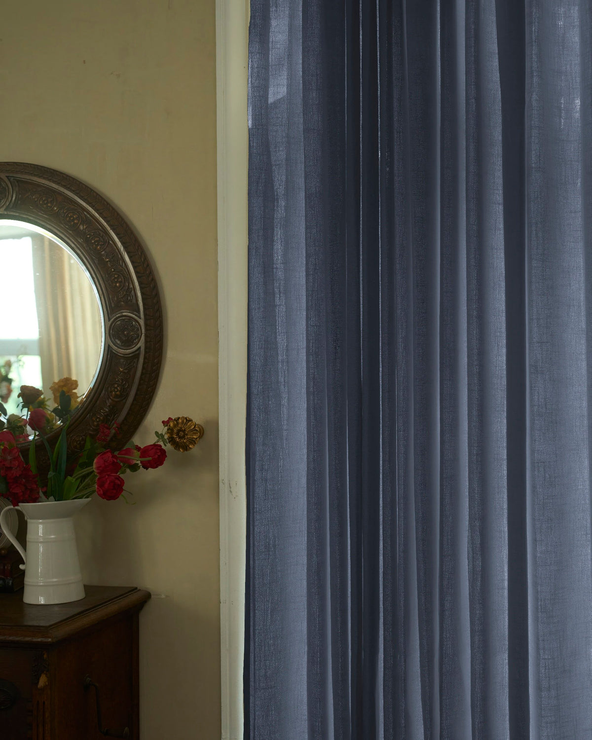 Deep blue Cassie Linen Blend custom curtains showcasing delicate texture and soft pleats, enhancing sophisticated home decor.