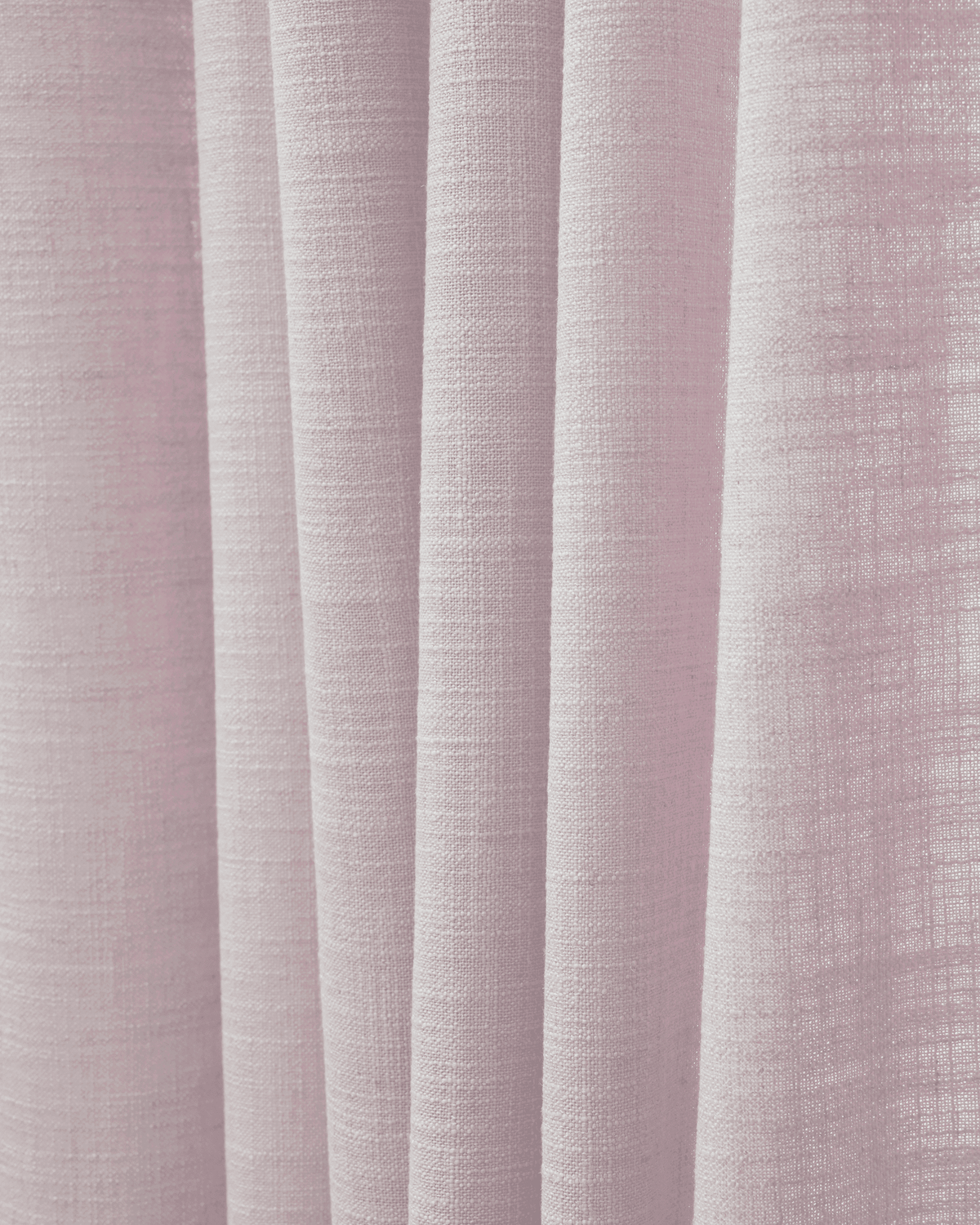 Close-up of Cassie linen blend fabric in a soft pink hue, showing its textured weave and elegant drapes for custom window treatments.