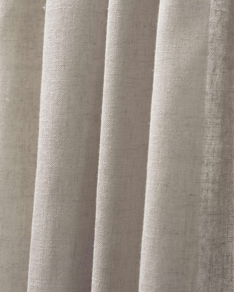 Close-up of Chloe linen look burlap textured sheer curtain in natural beige, highlighting its visible weave and soft folds.