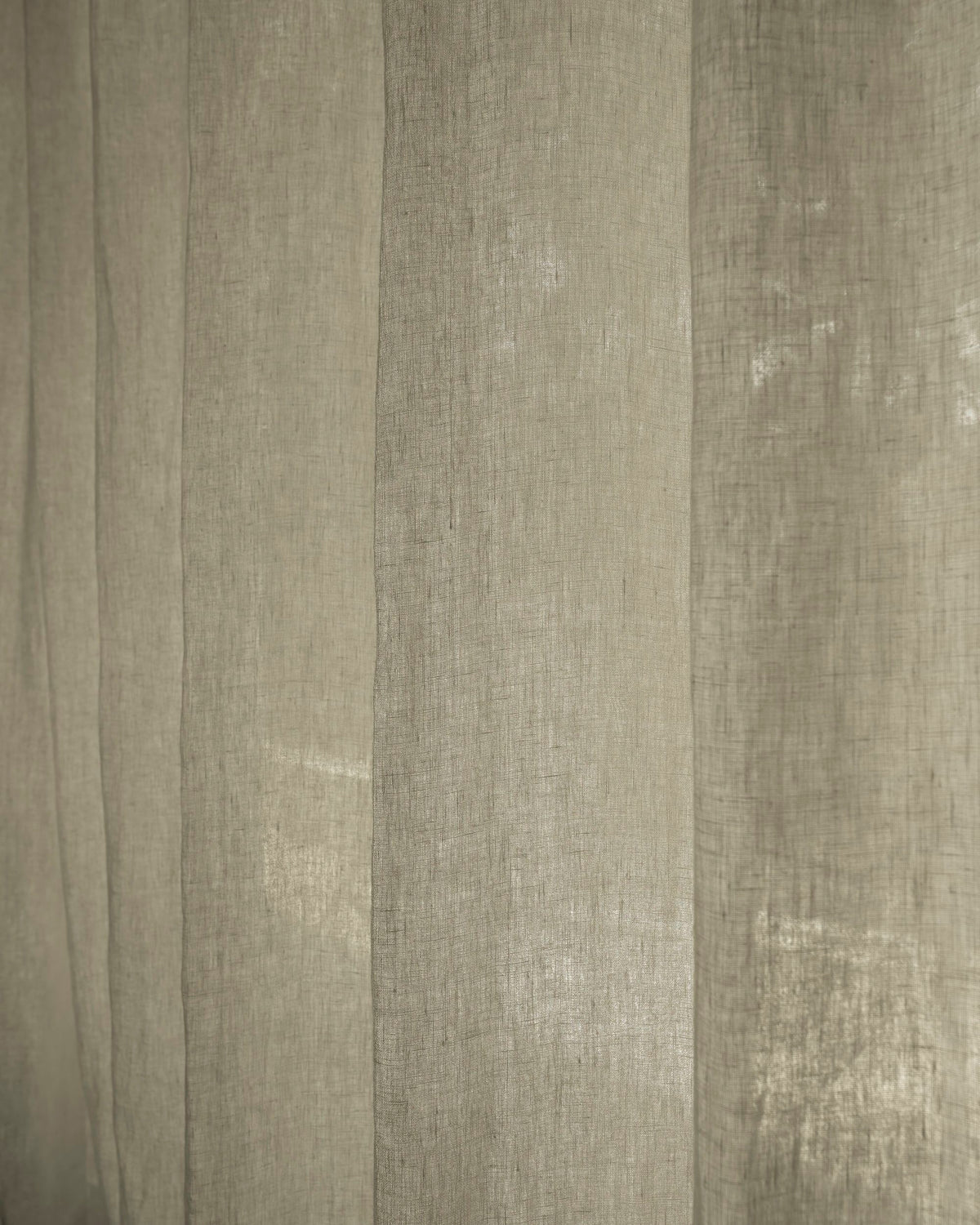 Close-up of Helena 100% pure linen custom curtain fabric, highlighting its natural woven texture and light-filtering quality.