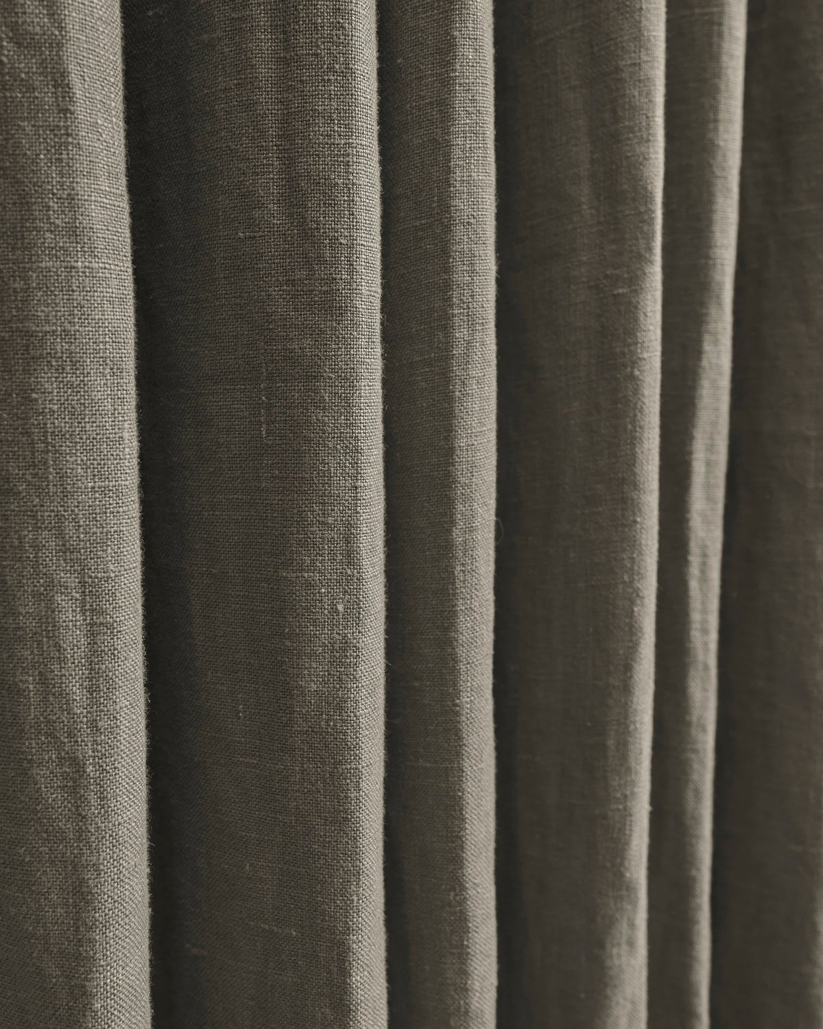 Detail of Helena 100% pure linen custom drapery, showcasing natural fabric texture and soft, tailored folds for home decor.