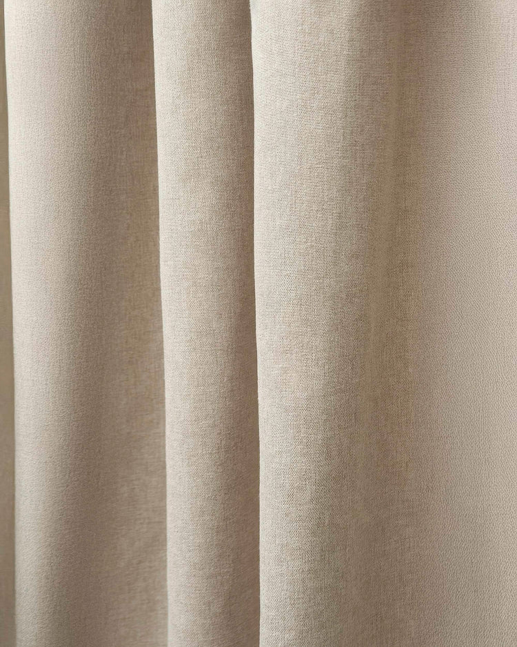 Detailed view of Laborien Linen Look Textured Custom Drapery fabric, highlighting its natural woven pattern in a soft beige tone.