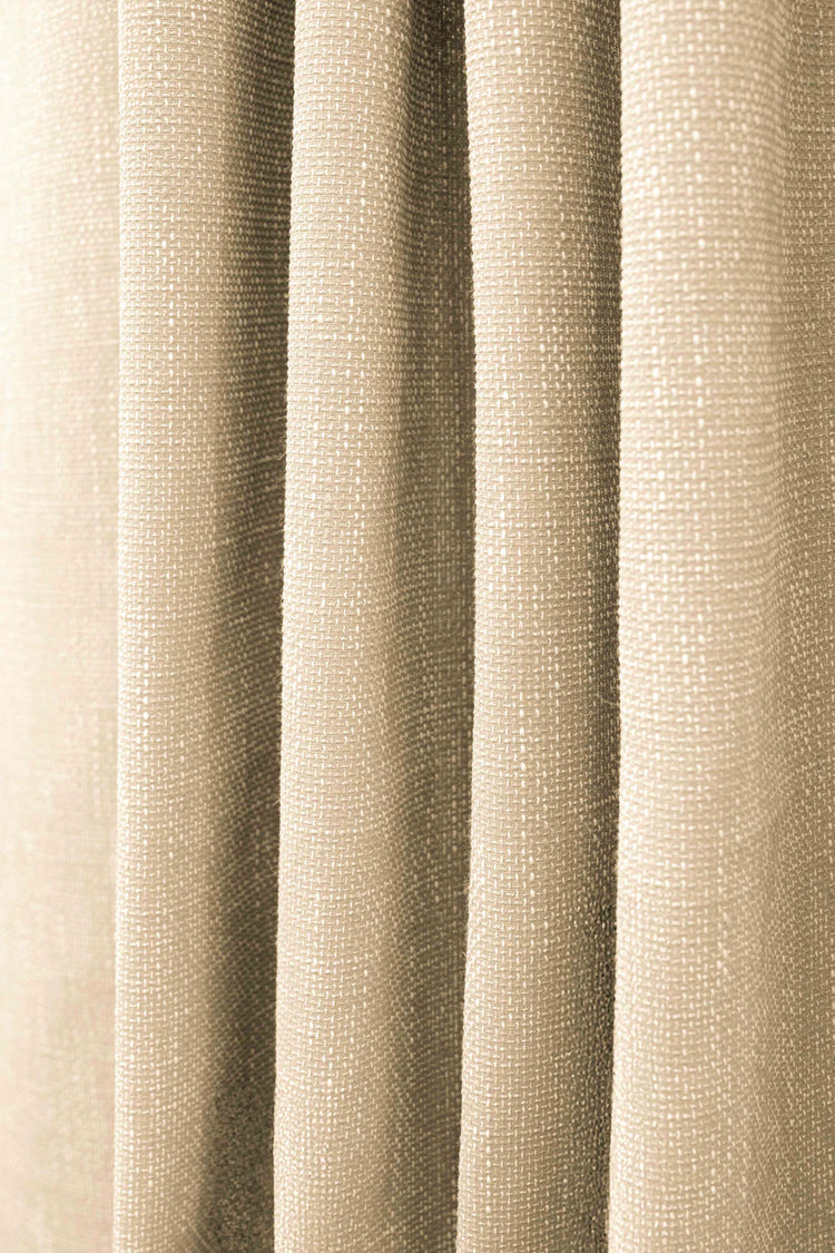 Detail of Munich custom outdoor curtain, highlighting its waterproof, woven textured fabric with a subtle pattern in beige.