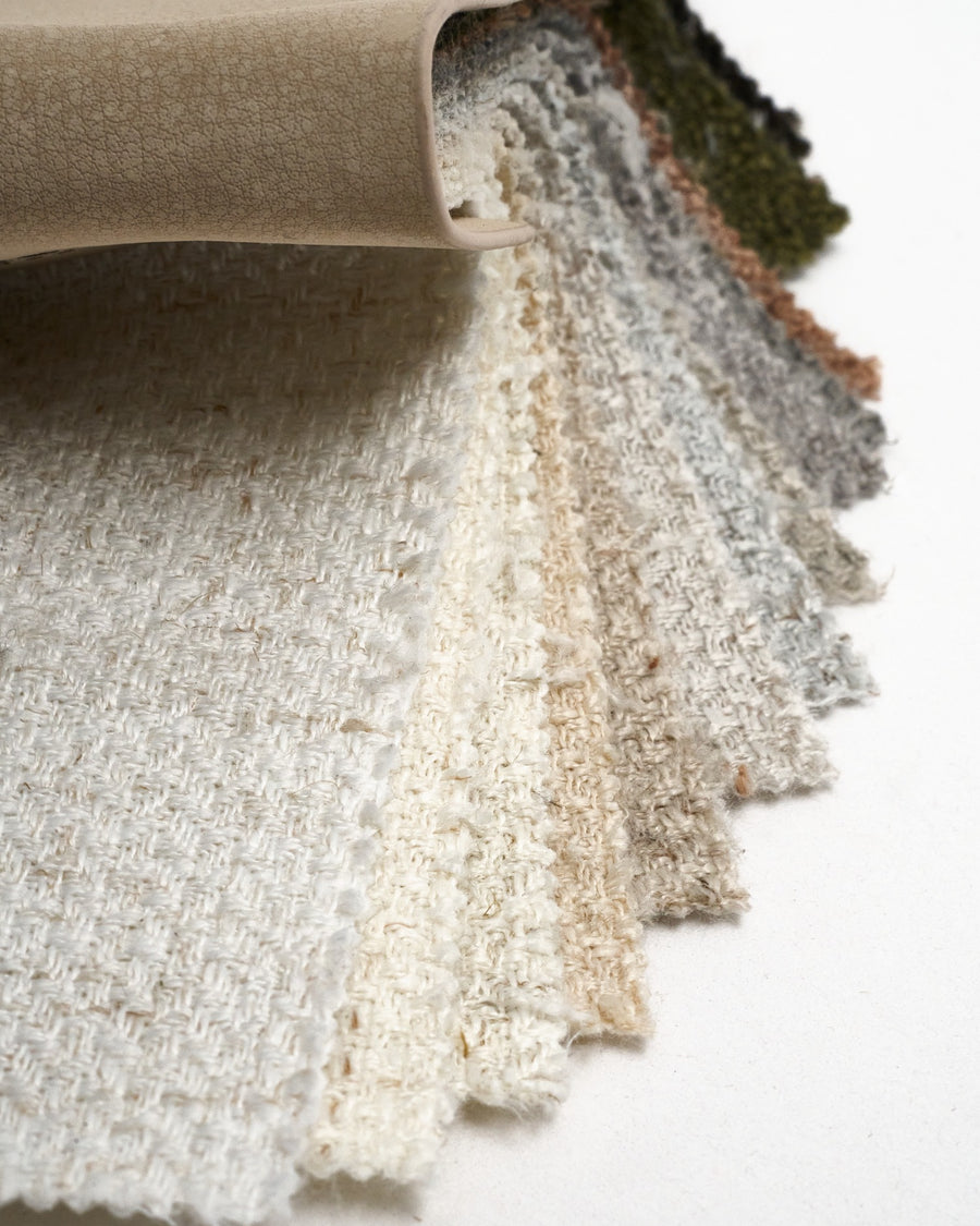 Fanned Iris textured fabric swatch book featuring 13 neutral and earthy colors for custom drapery and curtains.
