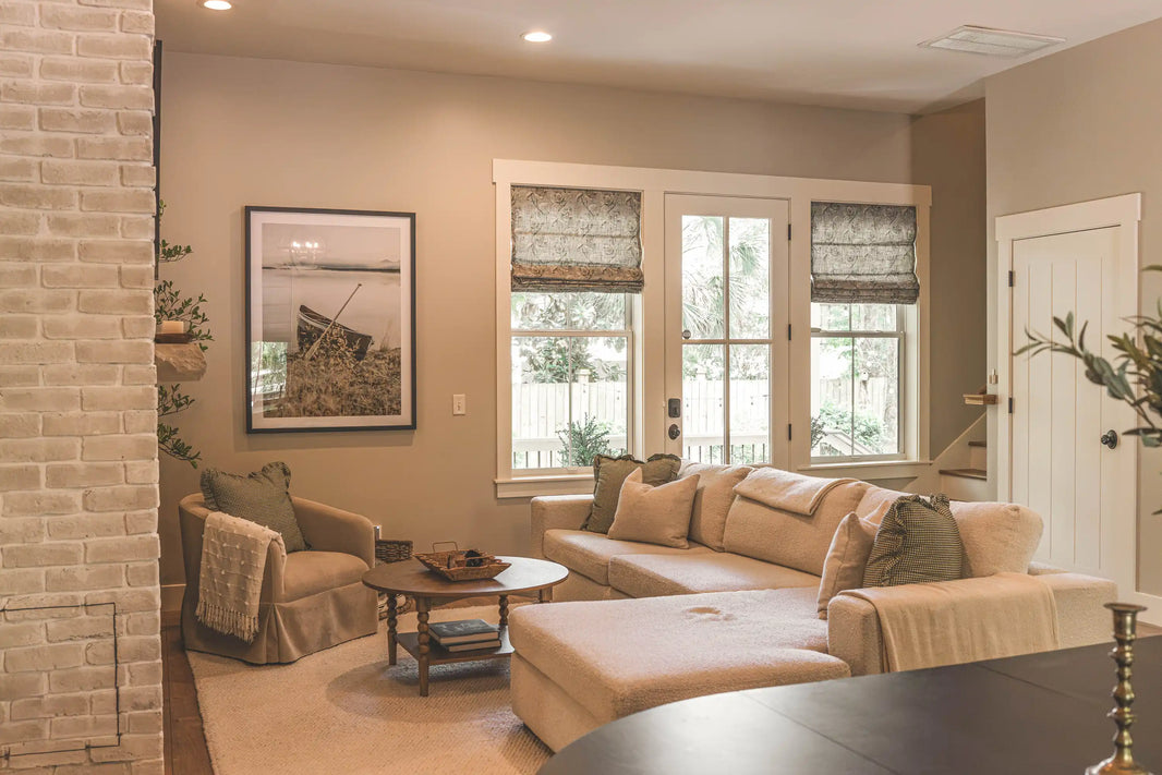 TheHues custom window treatments in a warm neutral living room styled with layered textures