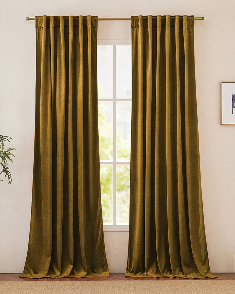 Jazlynn custom heavyweight golden velvet drapery panels beautifully framing a bright window, perfect for sophisticated home decor.