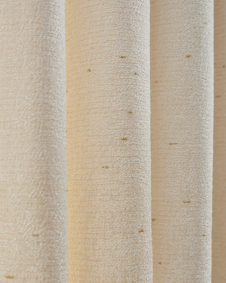 Close-up of Haze Linen Blend custom curtain fabric, revealing textured weave with subtle golden threads in soft, elegant folds.
