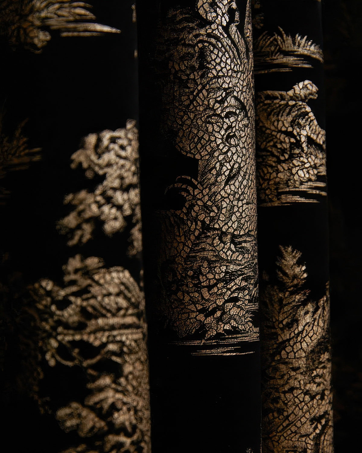Close-up of luxurious black velvet custom drapery with elegant gold foil Zen pattern, showcasing detailed Italian design.