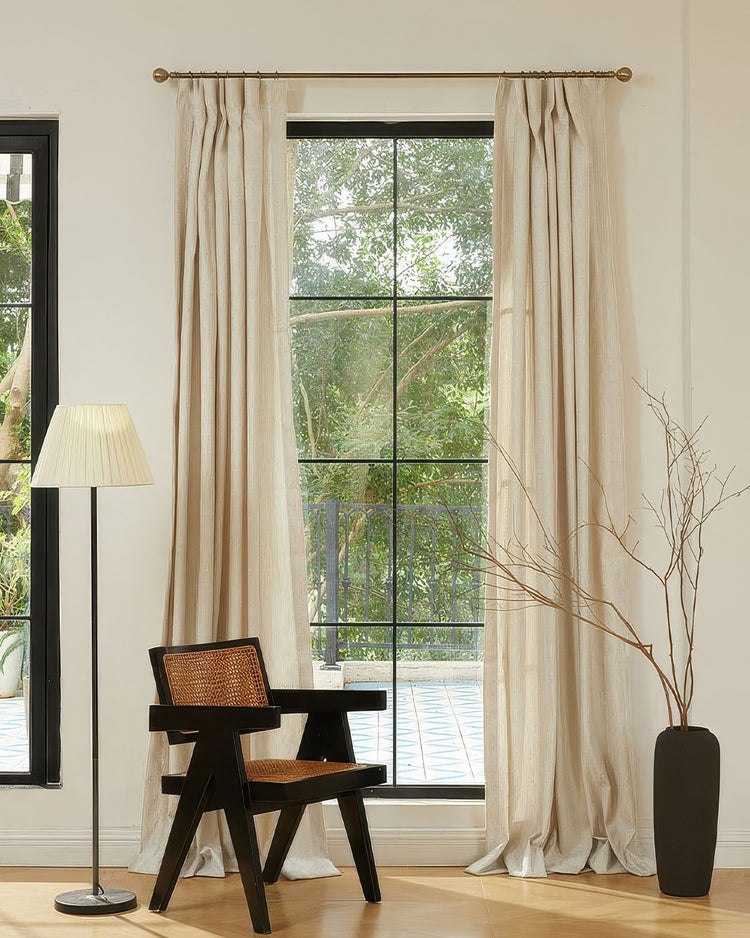 Glint Linen Blend Shimmering Textured Custom Curtains in cream, with elegant Pinch Pleat header, framing a large sunlit window.