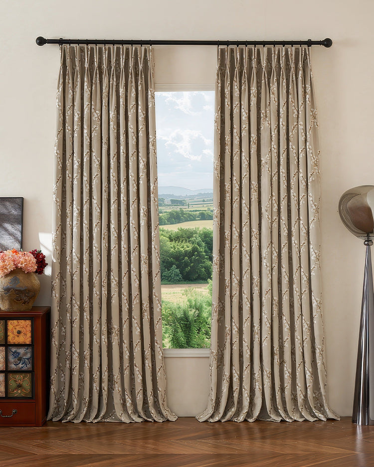 Luxurious Flora Velvet embroidered floral custom curtains with elegant pinch pleats, hanging as sophisticated window treatments.