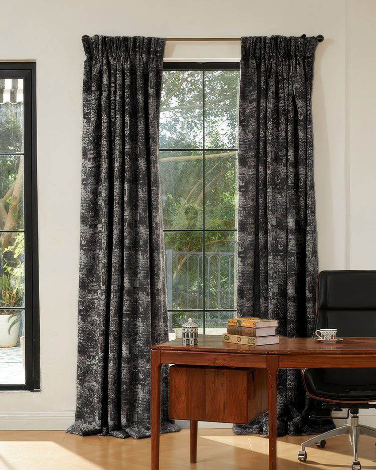 Mist patterned heavyweight soundproof thermal 100% blackout custom curtains elegantly draped over a large window in a home office.