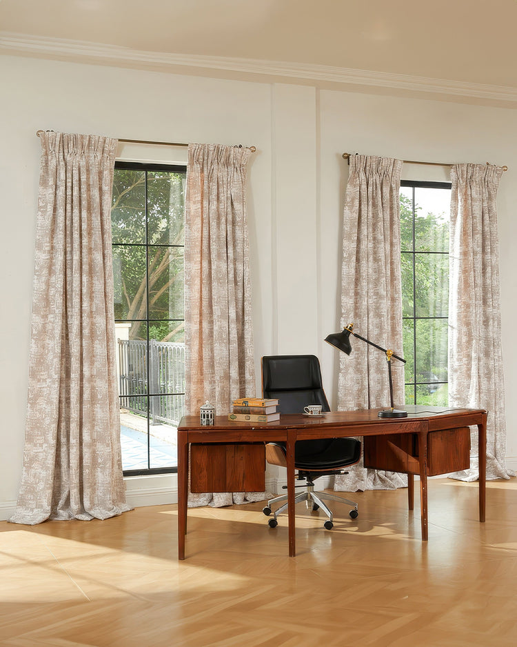 Light neutral Mist Patterned custom drapery with delicate patterns and elegant pleats framing two windows in a home office.