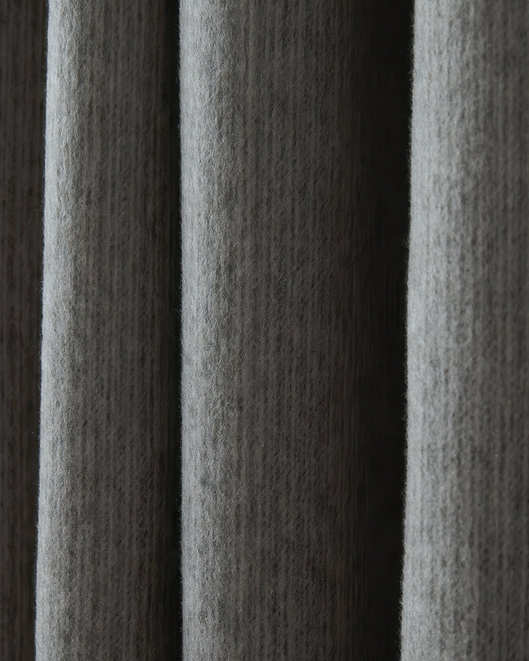 Close-up of plush grey Aspen Wool Blend Sweater Soft Textured Custom Curtain, highlighting its rich texture and luxurious drapery folds.