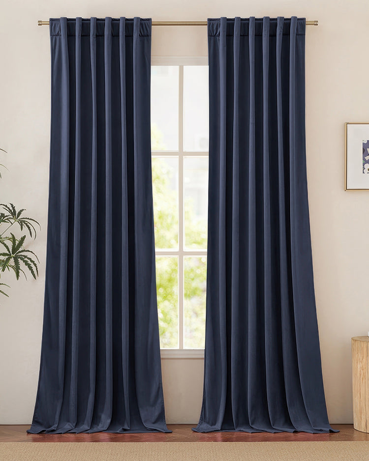 Luxurious navy blue velvet custom curtains with back tab header, providing heavyweight light control and elegant home decor.