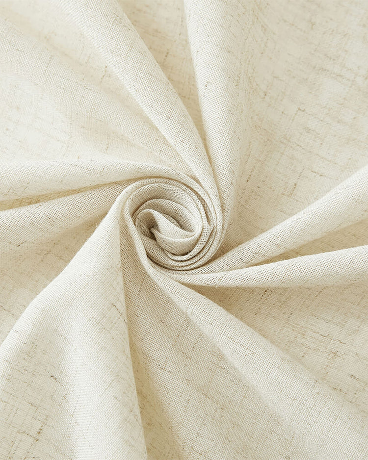 Textured light beige linen-look waterproof fabric for custom outdoor curtains, shown in a swirl.