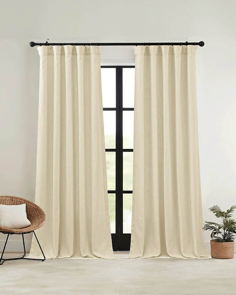 Voy thick linen look custom curtains in a cream shade, hung on a black rod, offering elegant made-to-measure window treatments.