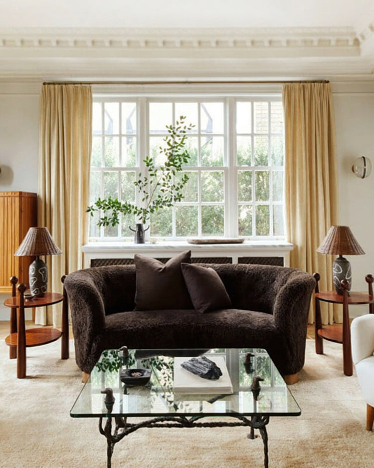 Voy Linen Look custom curtains in warm beige add elegance to a living room. Tailored drapery frame a large window for light control & privacy.