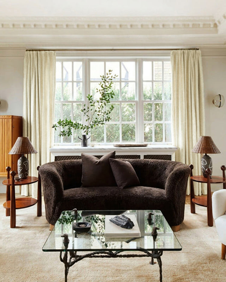 Elegant living room with custom Voy linen look curtains in a soft cream, enhancing light control and sophisticated home aesthetics.