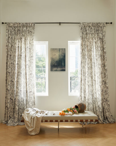 Full-length custom linen blend heavyweight peacock floral patterned curtains framing sunlit windows, elegant home decor.