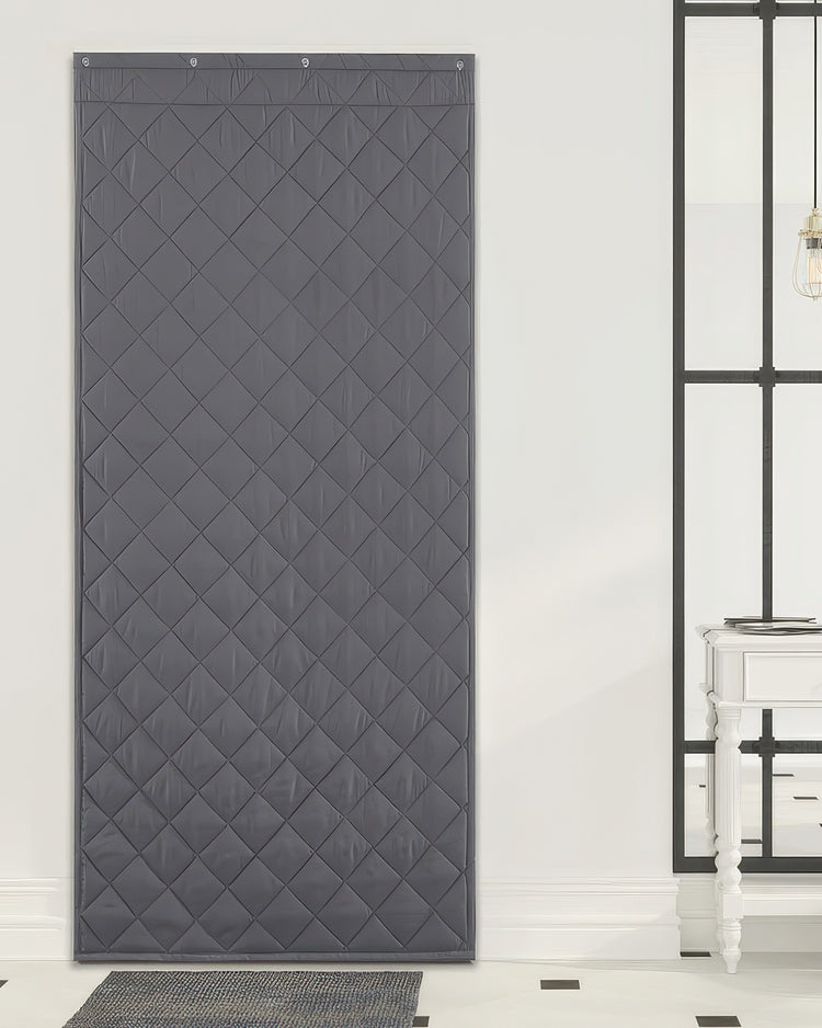 Dark gray quilted thermal insulated & soundproof custom door curtain with grommet header for tailored home privacy.
