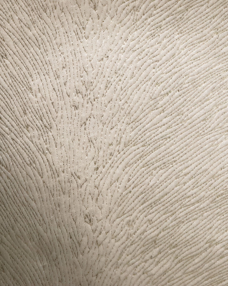 Close-up of Palma Foil Printed Velvet custom drapery fabric. Intricate shimmering pattern on luxury beige velvet.