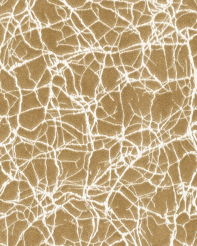 Close-up of Luxor foil printed velvet fabric, featuring a luxurious gold texture with a intricate white cracked pattern for custom curtains.