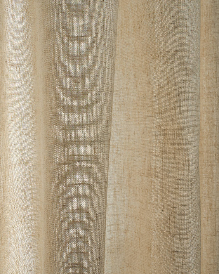 Close-up of beige Breeze Lightfiltering fabric swatch, showcasing its textured weave and translucent light-filtering quality.