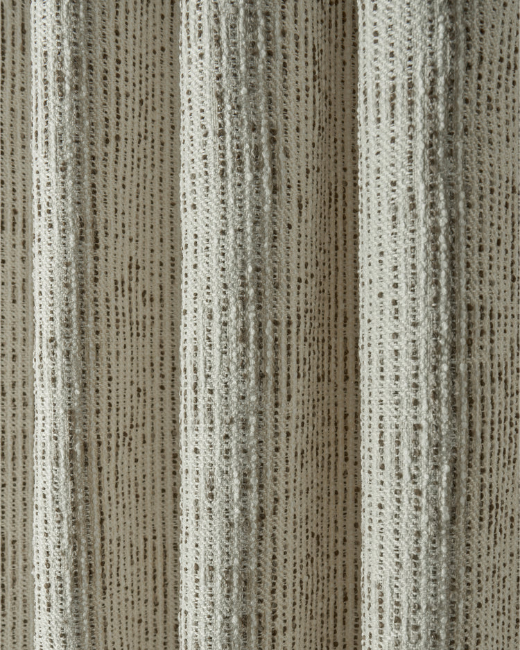 Draped Liwa linen blend custom drapery fabric with textured jacquard weave, earthy desert tones, and dotted pattern.