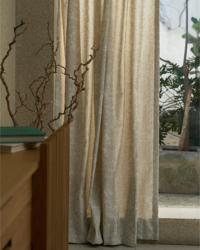Liwa Linen Blend Patterned Custom Curtain with thin vertical stripes, floor-length, enhancing privacy by a sunlit window.